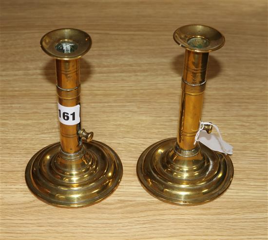 A pair of brass candlesticks